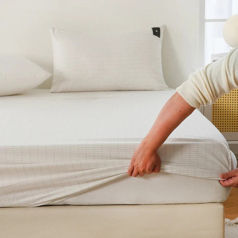 Step 1 — Place the bedsheet across your bed